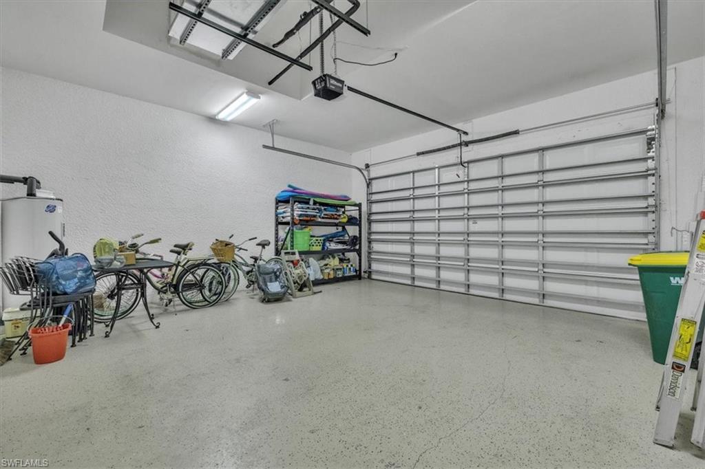 7793 Ashton Road Naples, FL 34113 - Photo 38 of 50 a view of a garage with storage