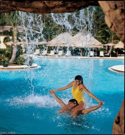 a view of a swimming pool with chairs