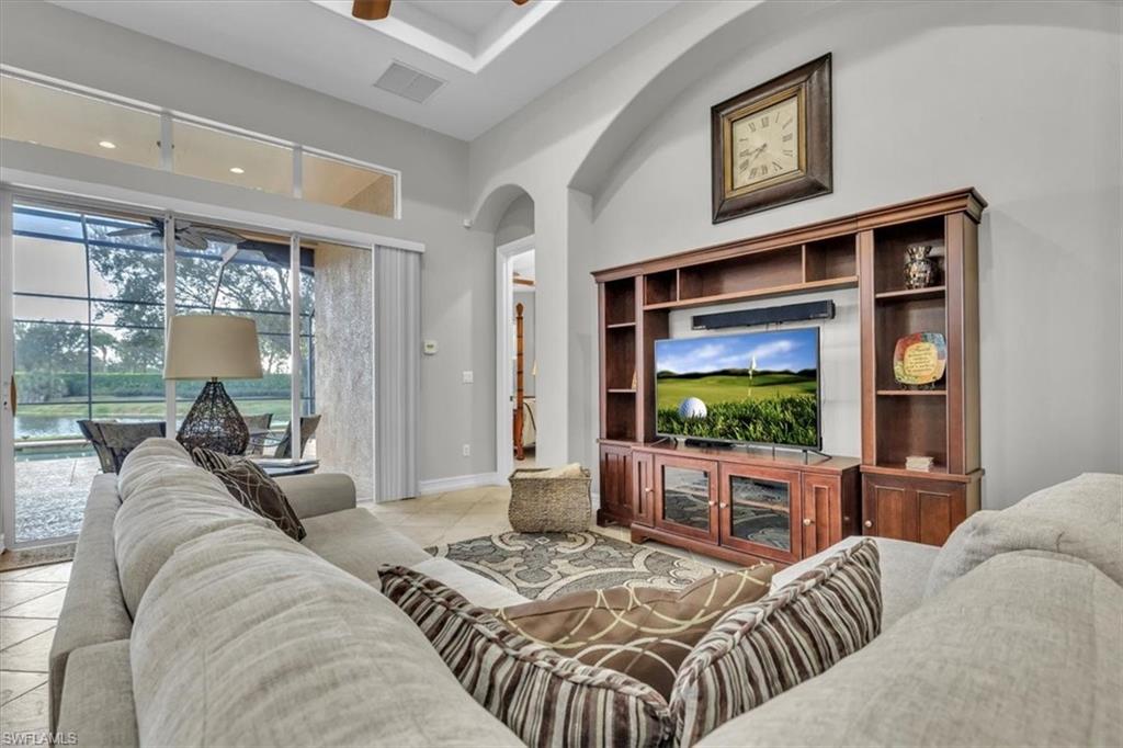 7793 Ashton Road Naples, FL 34113 - Photo 6 of 50 a living room with furniture and a flat screen tv