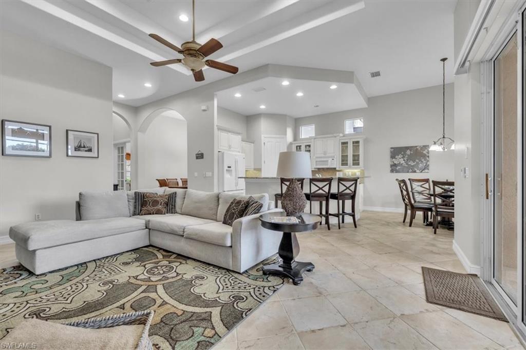 7793 Ashton Road Naples, FL 34113 - Photo 8 of 50 a living room with furniture and kitchen view
