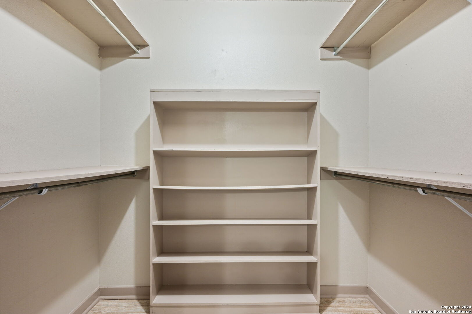 795 Highway 16 Jourdanton, TX 78026 - Photo 19 of 25 a view of an empty walk in closet