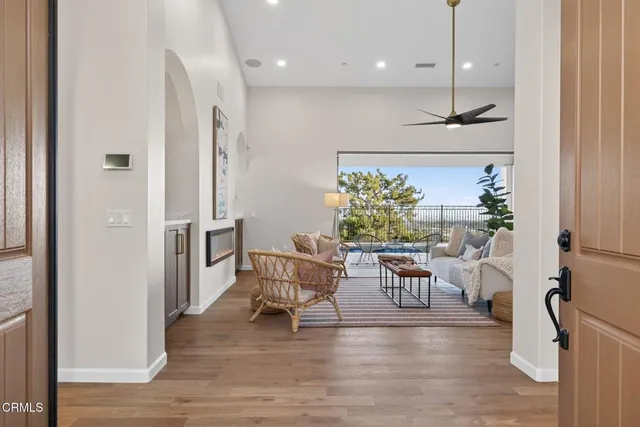 a living room with furniture and a lamp