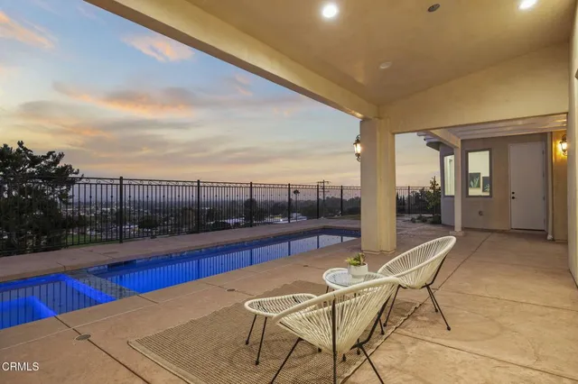 a spacious bedroom with a large bed and a view of bedroom