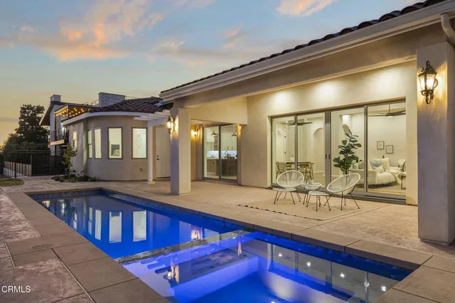a stove top oven sitting inside of a kitchen
