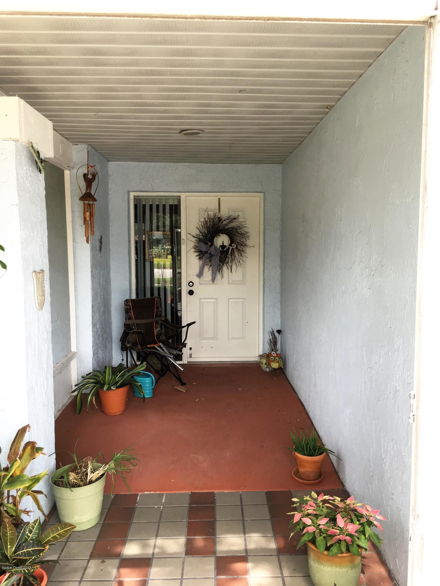 2395 Pepperwood Road Melbourne, FL 32935 - Photo 2 of 20 Front Screened Entry