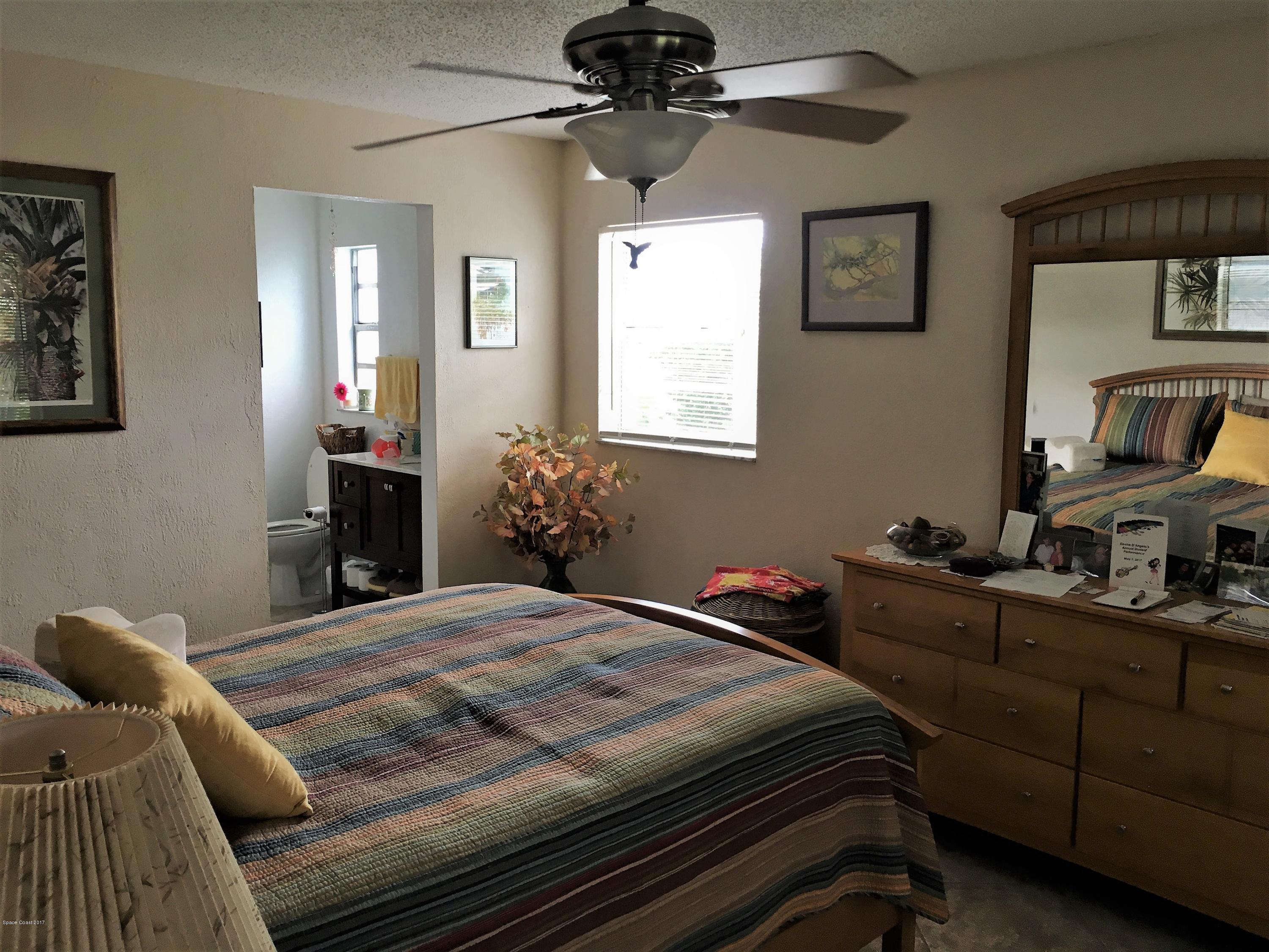 2395 Pepperwood Road Melbourne, FL 32935 - Photo 12 of 20 Master Bedroom