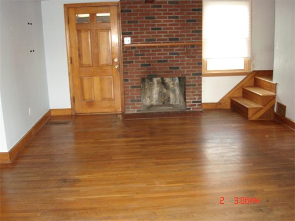 15 Batchelder Road Marblehead, MA 01945 - Photo 3 of 8 a view of empty room with wooden floor and fireplace