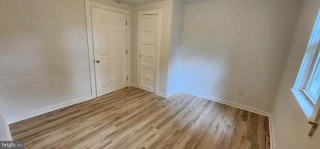 a view of wooden floor in an empty room