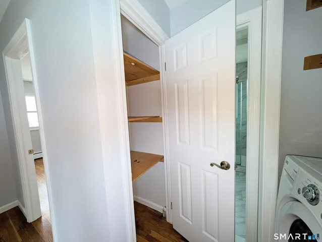 a view of front door with wooden floor