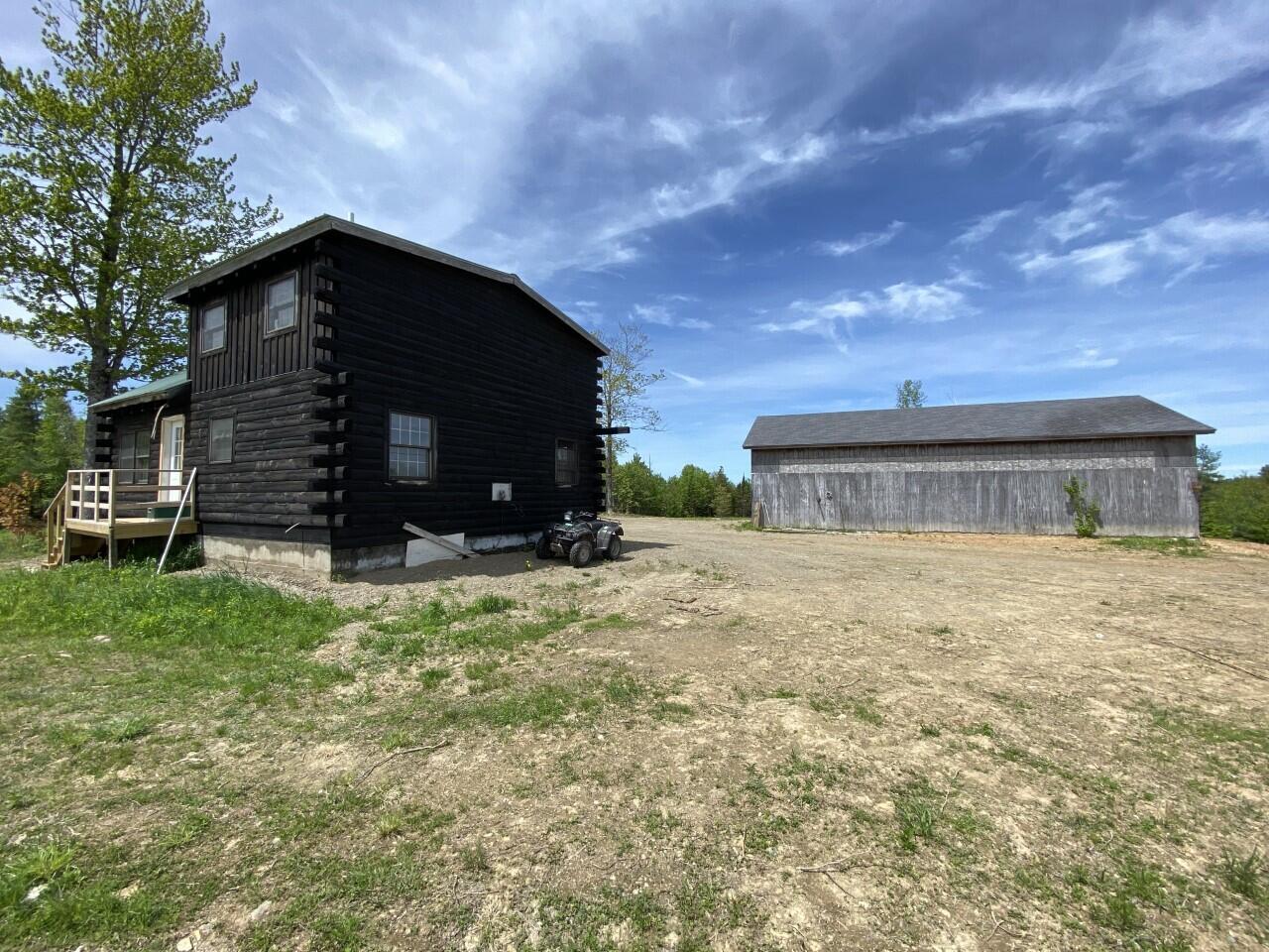 1015 Colby Road Palermo, ME 04354 - Photo 8 of 35 Backside of cabin and garage