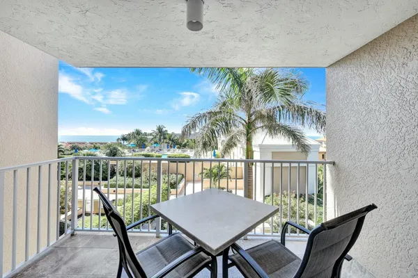 a view of a balcony with furniture