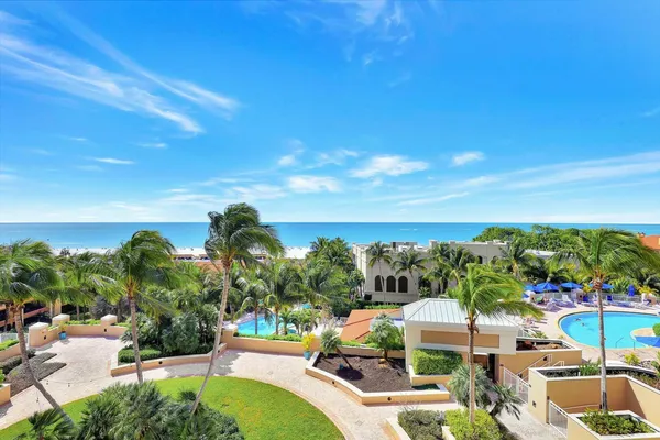 a view of a swimming pool with a yard