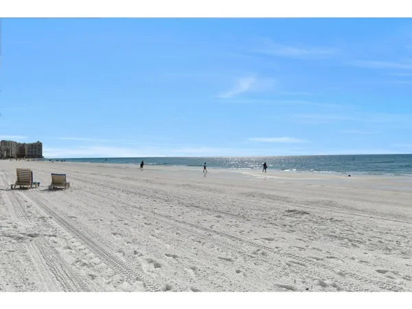 a view of beach and kitchen