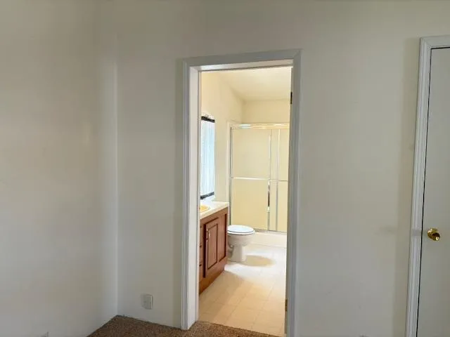 a view of a bathroom from a hallway