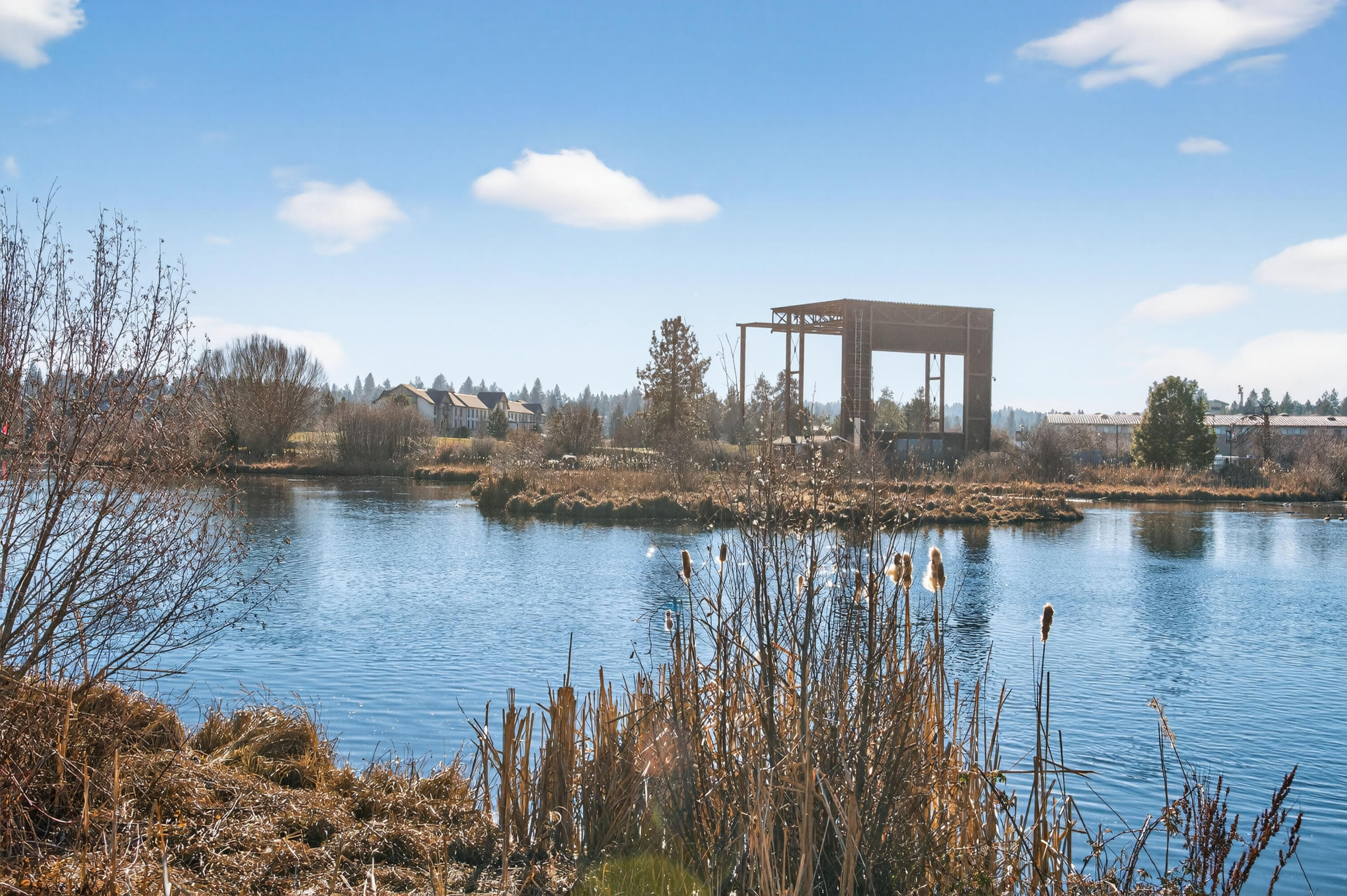 680 Southwest Otter Way Bend, OR 97702 - Photo 46 of 48 a view of a lake next to a building
