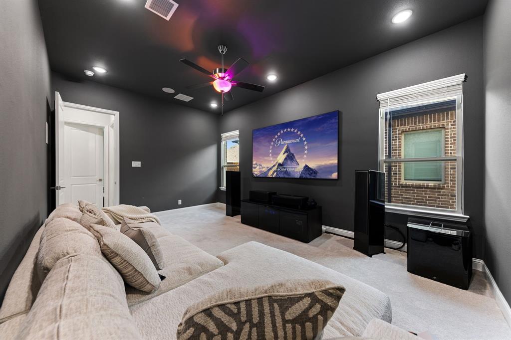 8808 Royal Star Road Rowlett, TX 75089 - Photo 33 of 40 a bedroom with a bed and a flat screen tv