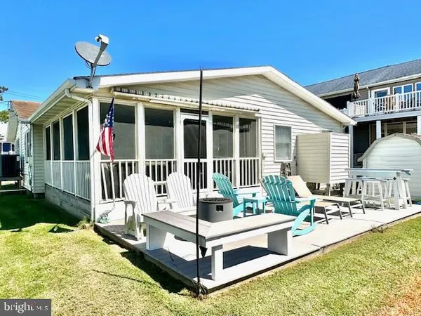 a front view of a house with a ocean view