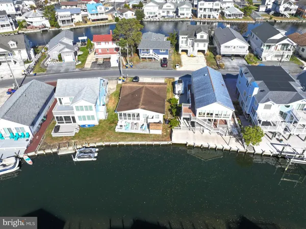 a view of multiple houses with outdoor space