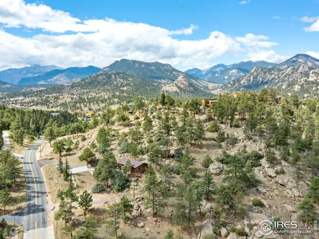 a view of a city with mountains in the background