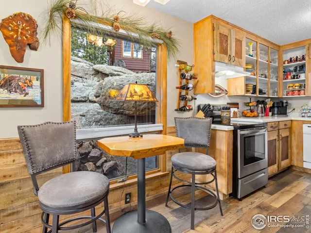 a dining room with furniture and wooden floor