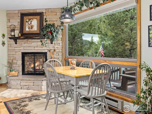 a view of a patio with a table and chairs