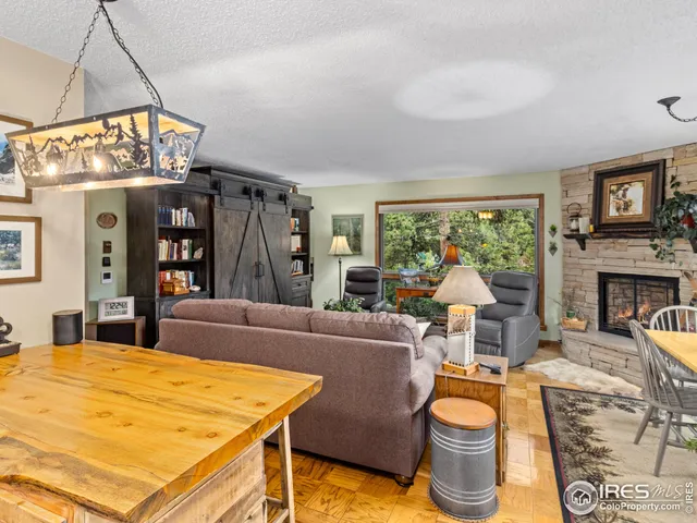 a living room with fireplace furniture and a flat screen tv
