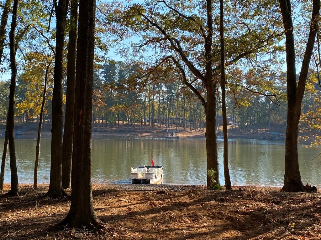 Perfectly level lake lot 1 mile from Clemson Blvd, with panoramic sunset views each evening!