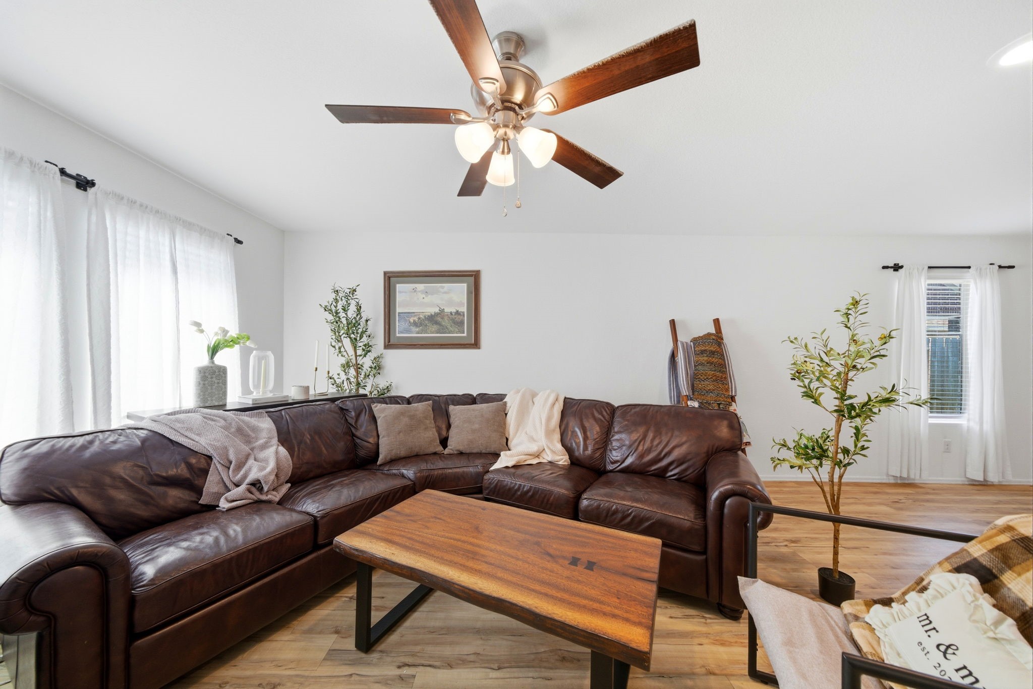 14502 Woodcott Warren Way Rosharon, TX 77583 - Photo 24 of 37 Enjoy enhanced comfort and atmosphere with an added living room fan and customizable dimmable lighting.