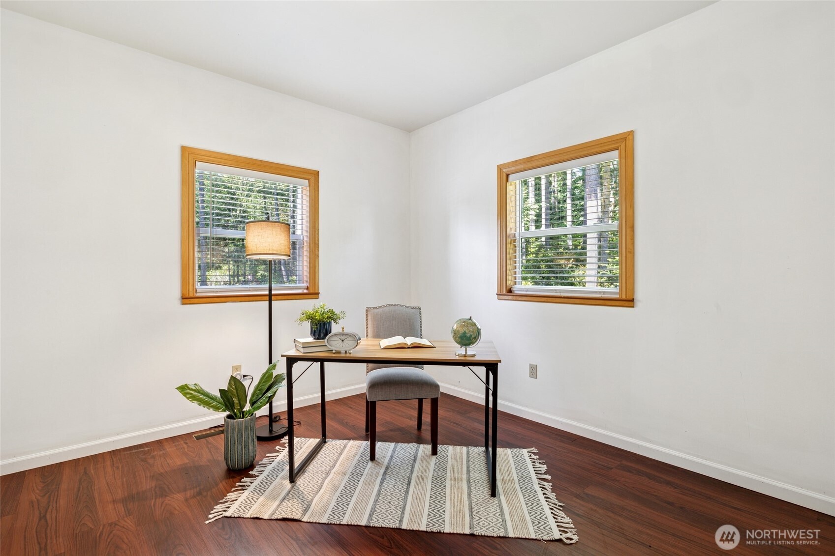4987 Mutiny Bay Road Freeland, WA 98249 - Photo 14 of 40 a workspace room with furniture and wooden floor