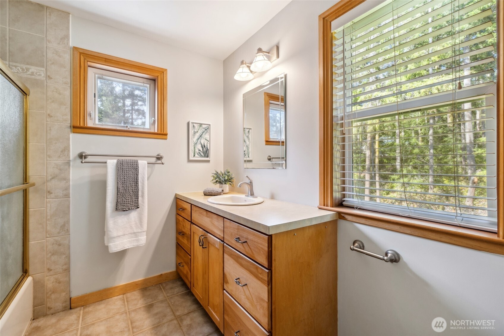4987 Mutiny Bay Road Freeland, WA 98249 - Photo 15 of 40 a utility room with a stove a sink and a refrigerator
