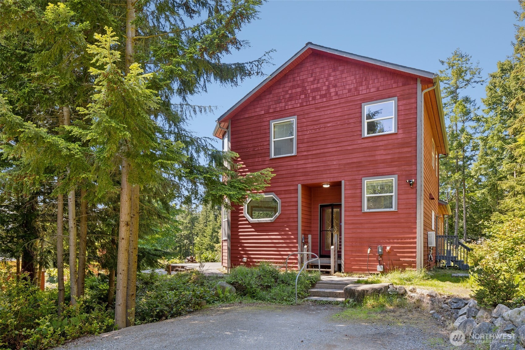 4987 Mutiny Bay Road Freeland, WA 98249 - Photo 2 of 40 a front view of a house with garden