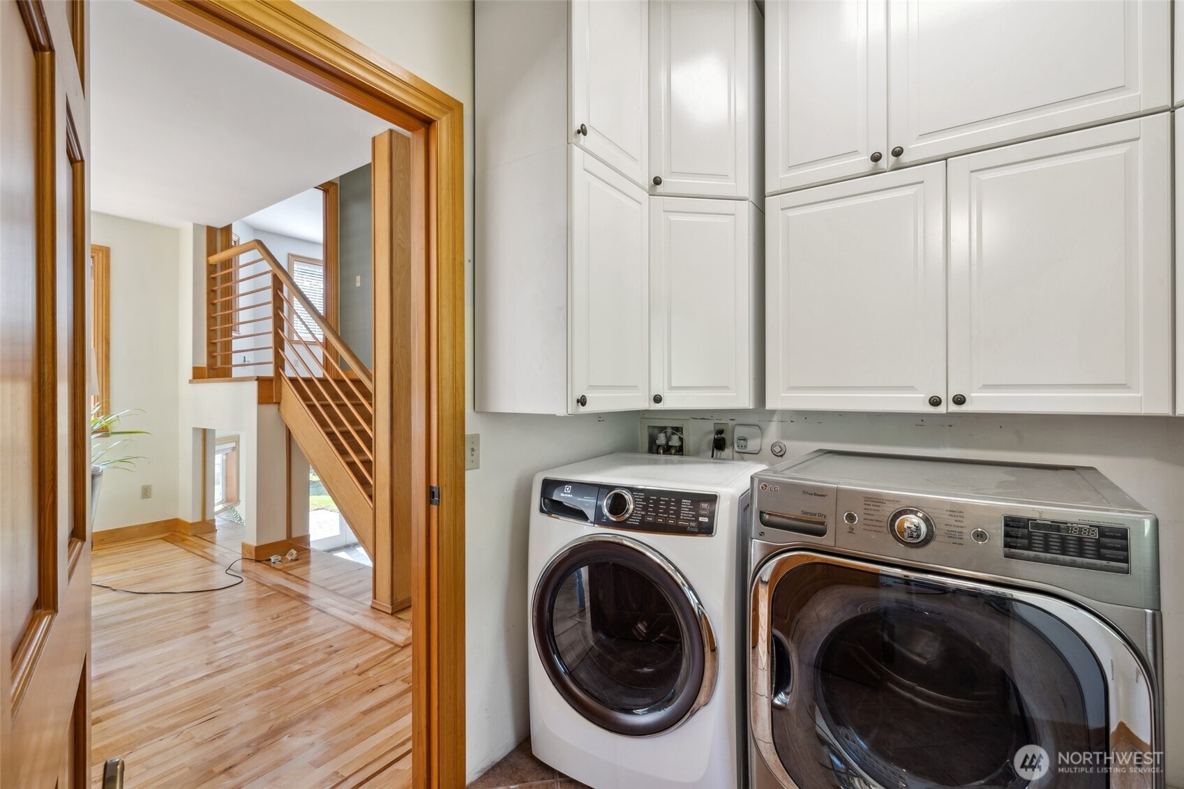 4987 Mutiny Bay Road Freeland, WA 98249 - Photo 24 of 40 a view of a hallway with washer and dryer