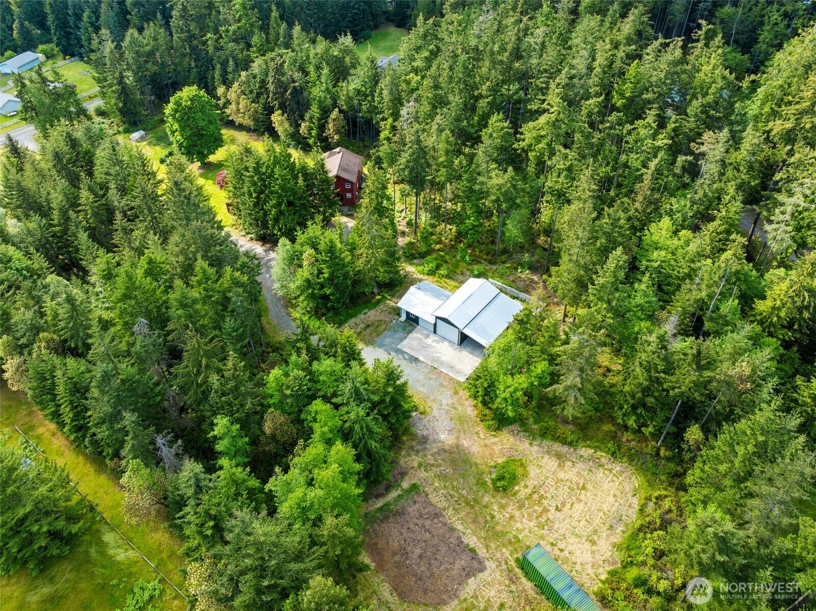 4987 Mutiny Bay Road Freeland, WA 98249 - Photo 35 of 40 a view of a house with a yard