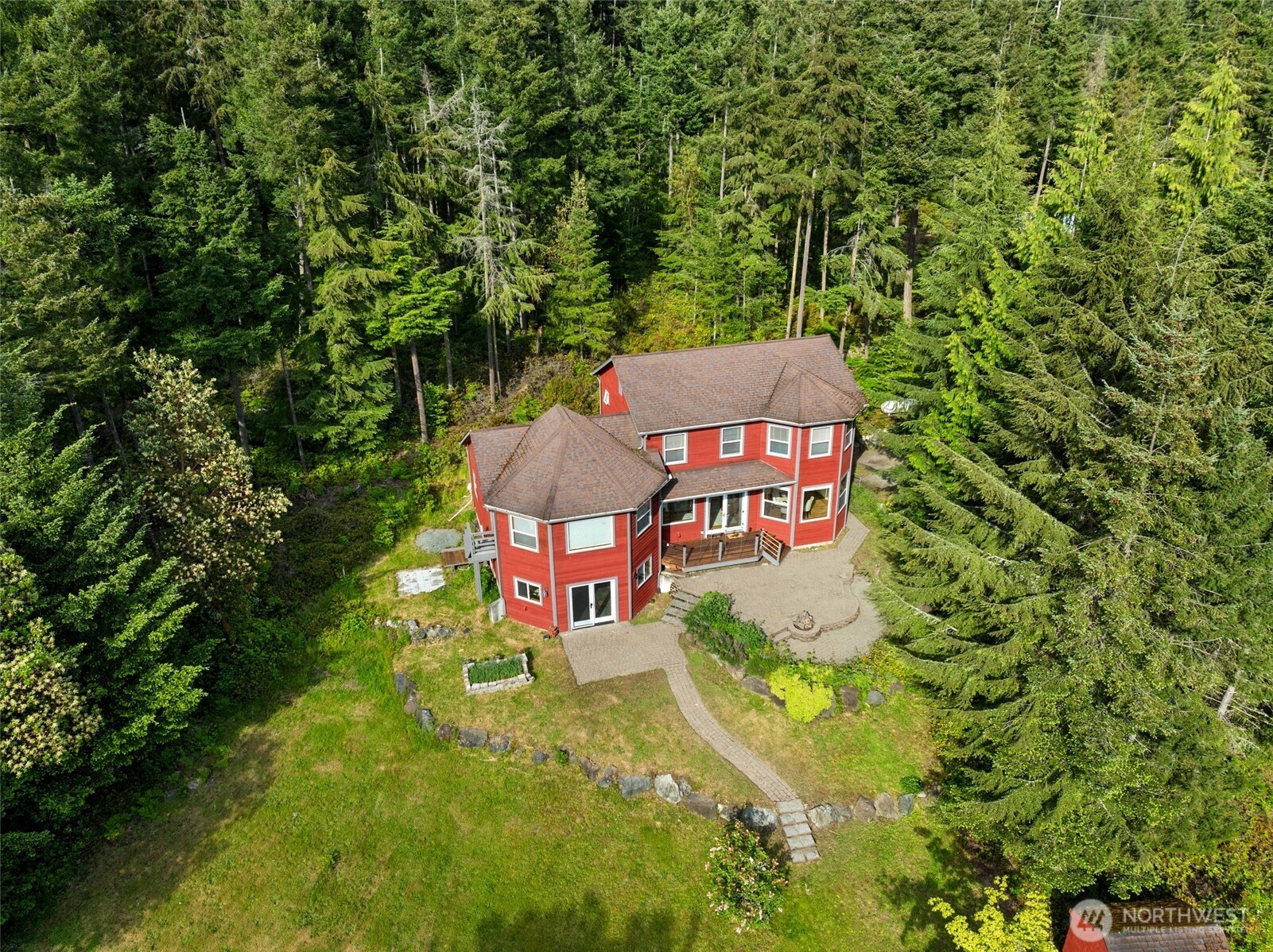 4987 Mutiny Bay Road Freeland, WA 98249 - Photo 36 of 40 a sign that is sitting on a brick wall