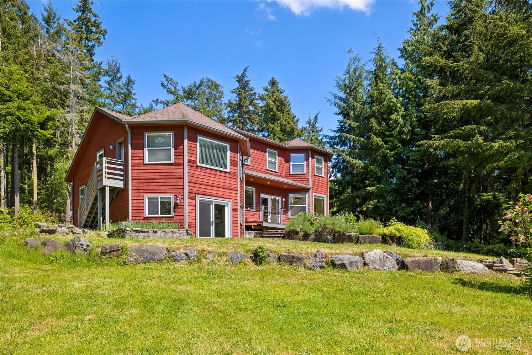 4987 Mutiny Bay Road Freeland, WA 98249 - Photo 39 of 40 a front view of a house with a yard table and chairs