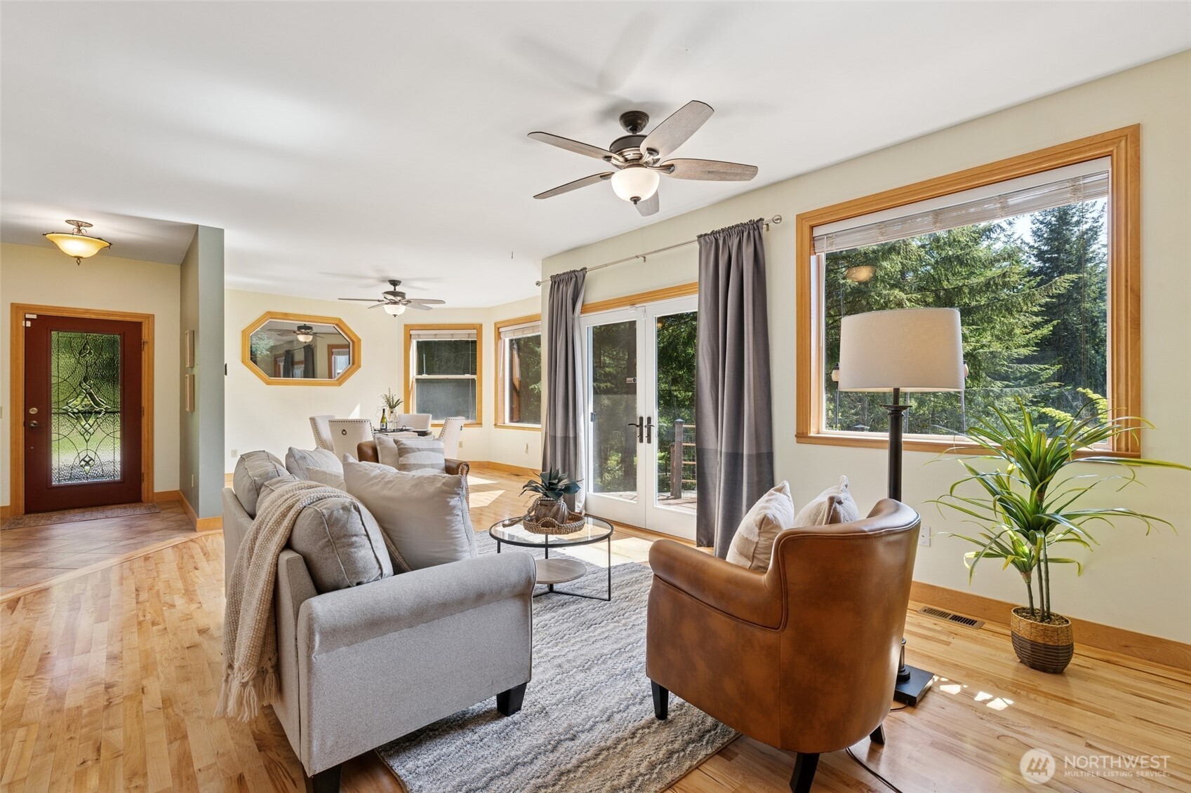 4987 Mutiny Bay Road Freeland, WA 98249 - Photo 5 of 40 a living room with furniture and a large window