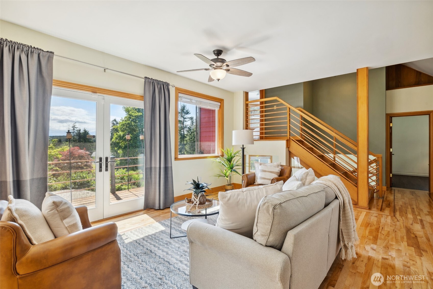 4987 Mutiny Bay Road Freeland, WA 98249 - Photo 6 of 40 a living room with furniture and a large window