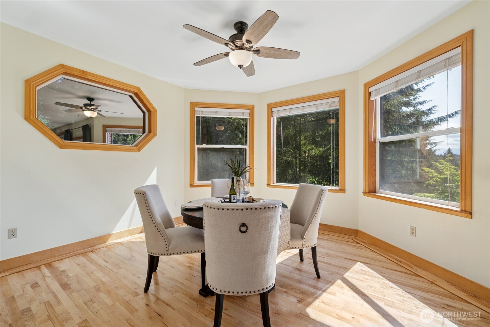 4987 Mutiny Bay Road Freeland, WA 98249 - Photo 10 of 40 a dining room with furniture window and wooden floor