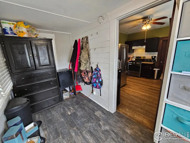 a view of living room with furniture and wooden floor