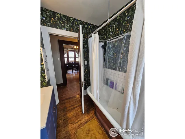 a bathroom with a tub and a shower