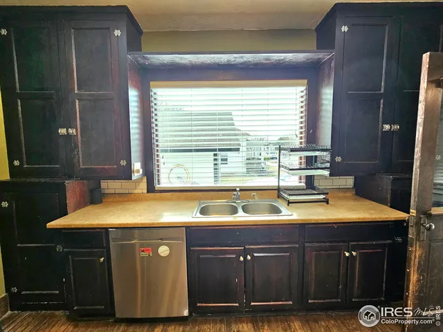 a kitchen with a sink and a cabinets