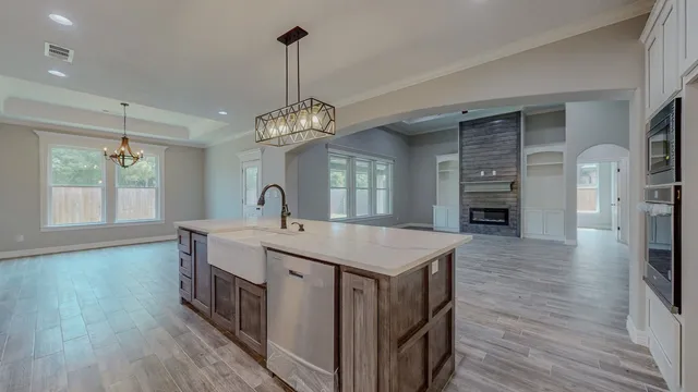 a kitchen with a sink and a refrigerator