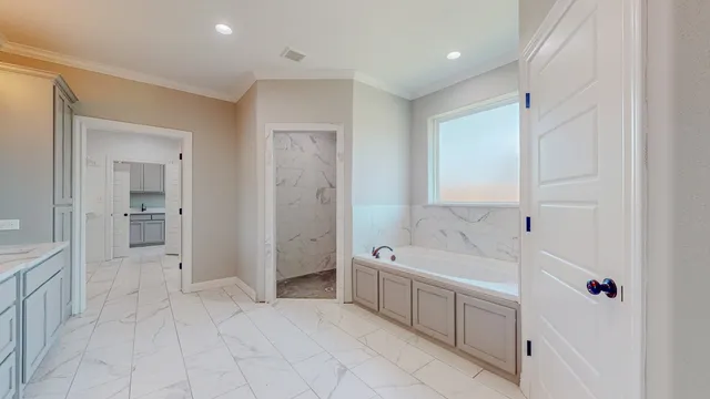 a spacious bathroom with a double vanity sink mirror and shower