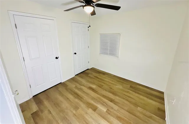 a view of room with a ceiling fan