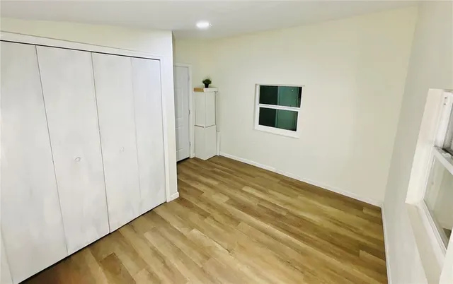 a view of a room with a wooden floor