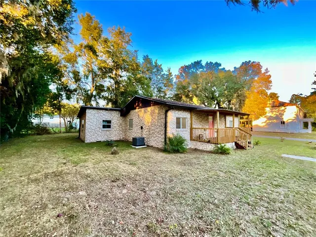 a backyard of a house with lots of green space