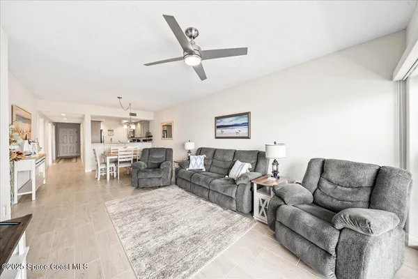 a living room with furniture and white walls