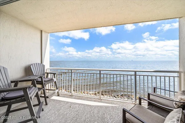 a view of balcony with furniture