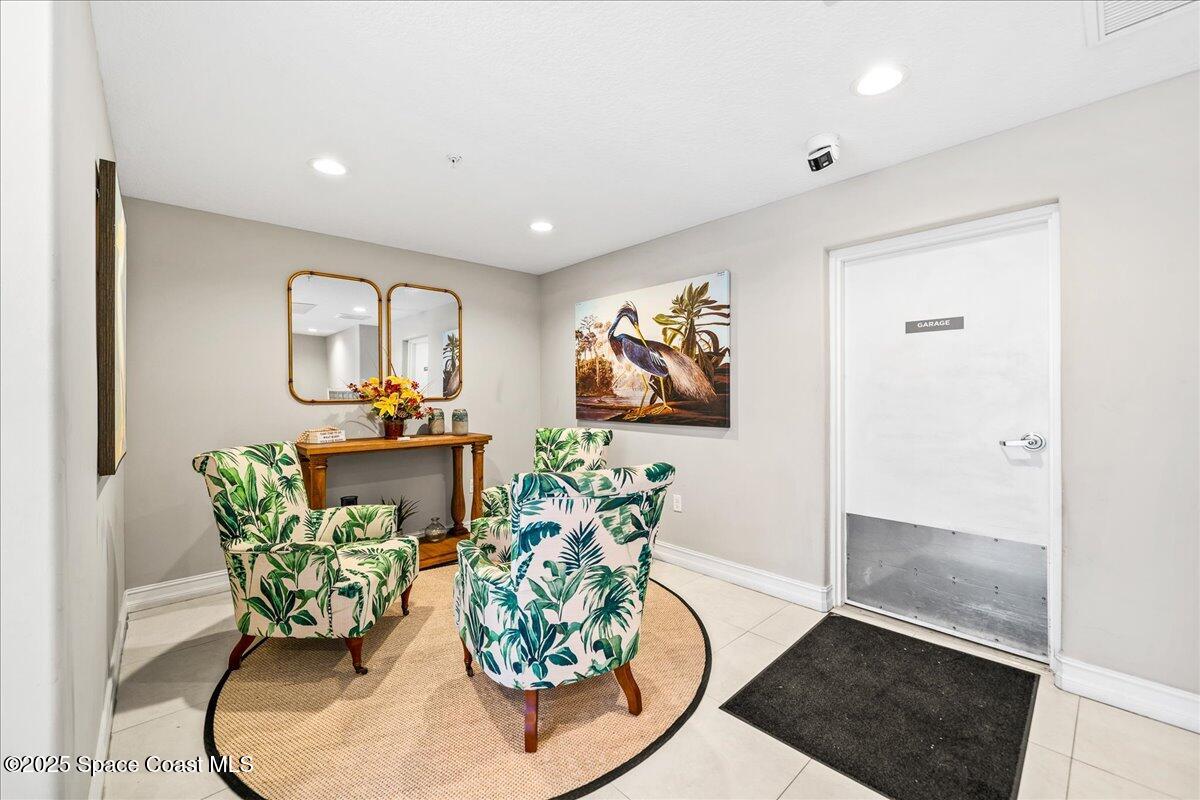 1805 Riverside Drive, Unit 206 Titusville, FL 32780 - Photo 37 of 51 Lobby to Garage