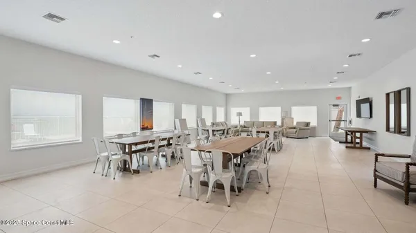 a view of kitchen with stainless steel appliances refrigerator oven and cabinets